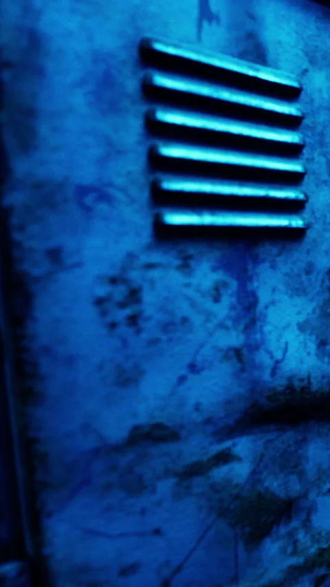 Metal locker with blue lighting and texture in an indoor setting Stock Footage 339511153