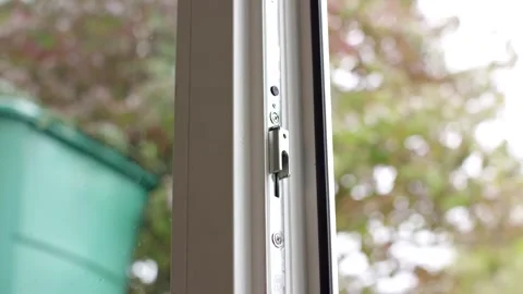 Metal Locking Mechanism on Tilted Window, Green Garden View, Close Up Shot Stock Footage 341526664