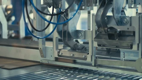 Metal machine is transporting carton sheets Stock Footage 128394626