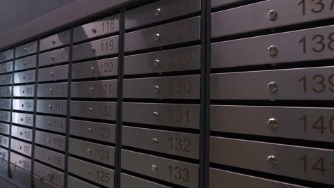 Metal mailboxes with apartment numbers in a multi-story building Stock Footage 321004232