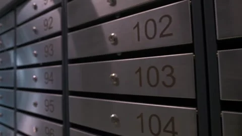 Metal mailboxes with apartment numbers in a multi-story building Stock Footage 321004272