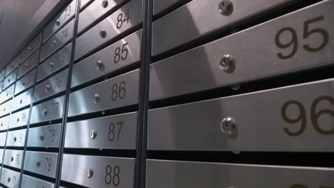 Metal mailboxes with apartment numbers in a multi-story building Stock Footage 321004322