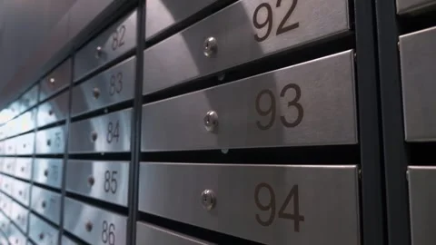 Metal mailboxes with apartment numbers in a multi-story building Stock Footage 321004446