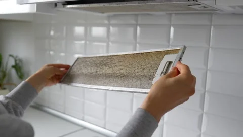Metal mesh filter struggles with heavy grease due to regular frying. Man holding Video stock 311978739