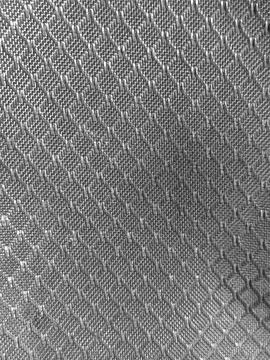 Metal mesh texture with reflective pattern background Stock Photos