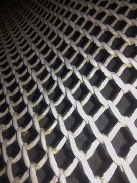 Metal mesh on the wall Stock Photos