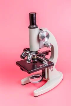 Metal microscope on blue background Stock Photos