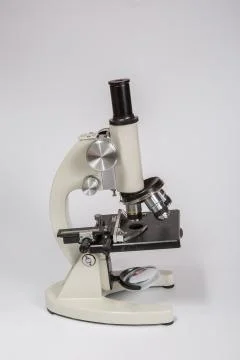 Metal microscope on white background Stock Photos