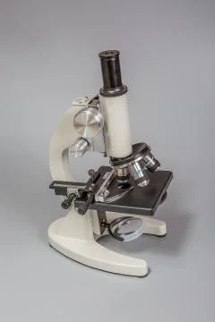 Metal microscope on white background Stock Photos