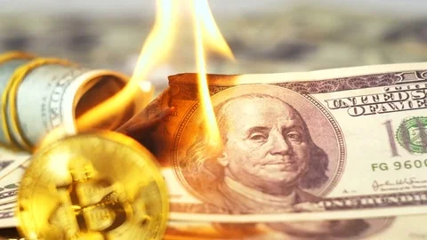 Metal Model of Digital Cryptocurrency against Burning Dollar Stock Footage 80169631