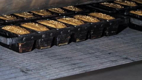 Metal molds for bread with dough move inside an industrial oven Video stock 245560186