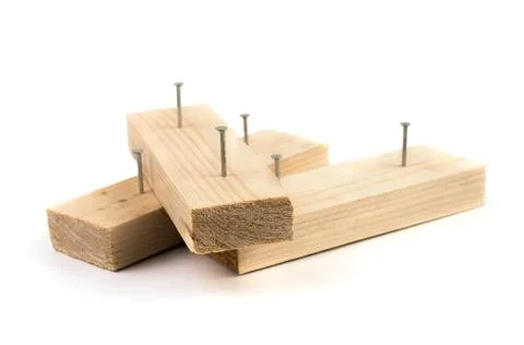 Metal nails not completely driven into wooden slats. Stock Photos