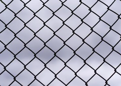 Metal net of grids - industrial pattern Stock Photos