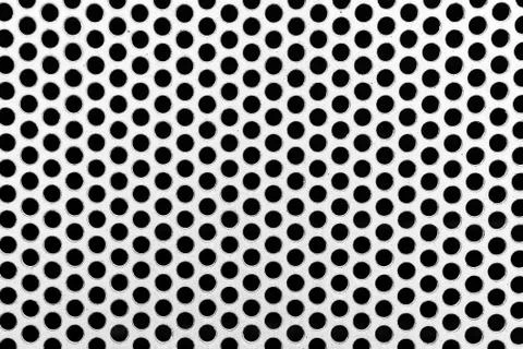 Metal net with perforated circles Stock Photos