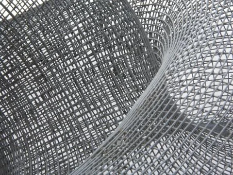 Metal net twisted in different ways Stock Photos