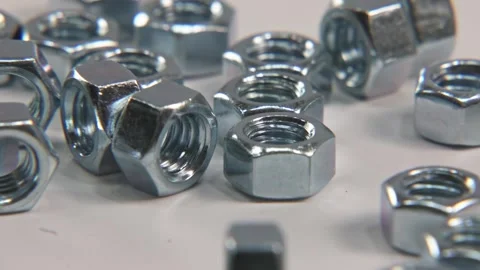 Metal nut nuts for tools and bolts in slo mo 4k studio Video stock 329707302