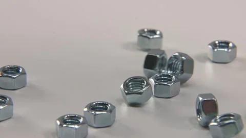 Metal nut nuts for tools and bolts in slo mo 4k studio Video stock 329708710
