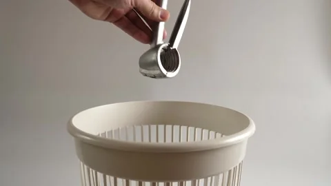 The metal nutcracker is thrown into the trash for recycling Stock Footage 260601849