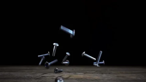 Metal nuts falling in slow motion Stock Footage 153027067