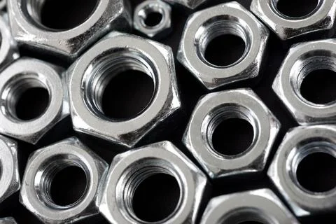 Metal nuts group on a table Фото