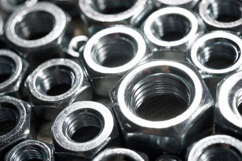 Metal nuts group on a table Stock Photos
