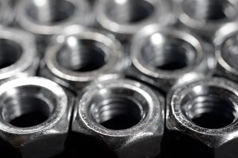 Metal nuts group on a table Stock Photos