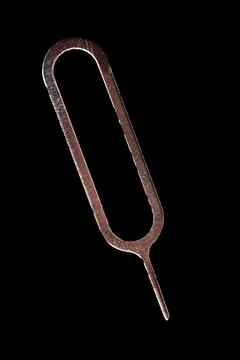 A metal object with a pointed end and a rounded end Stock Photos