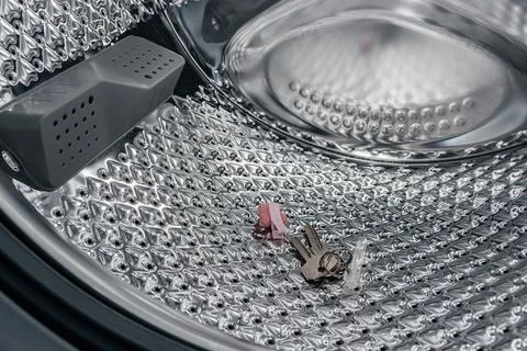 Metal objects found in washing machine, that damage washing machine if left in Stock Photos