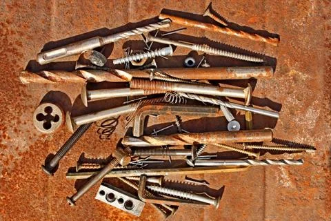 Metal objects on the rusty iron sheet Stock Photos