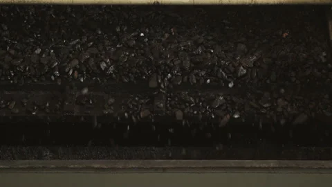 Metal ore vibrating conveyor, heavy duty steel plates with coal Stock Footage 205218606