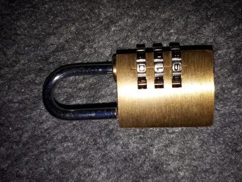 Metal padlock for locking with a code Stock Photos