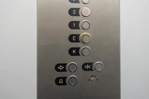 Metal panel shows elevator floor buttons Stock Photos