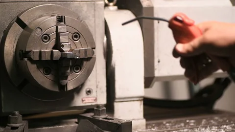 Metal part drill process work lathe engineer hands Stock Footage 136421218