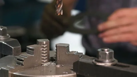 Metal part drill process work lathe engineer hands Stock Footage 136427447