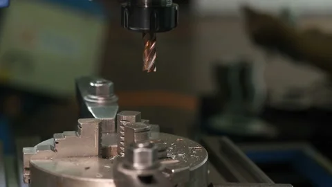 Metal part drill process work lathe engineer hands Stock Footage 136428927