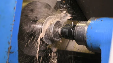 Metal part drill process work lathe cooling liquid Stock Footage 136470289