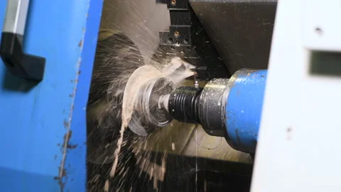 Metal part drill process work lathe cooling liquid Stock Footage 136472319