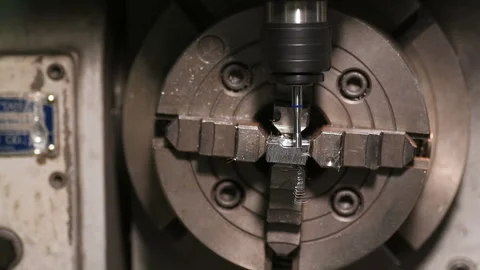 Metal part drill processing work lathe shavings Stock Footage 136429842