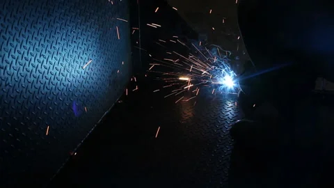 Metal pattern being illuminated by welding arc used to join sheets Stock Footage 204914684