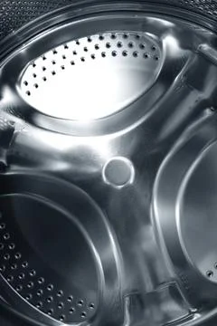 Metal pattern Metal circular element of washing machine. Close-up photo Co... Stock Photos