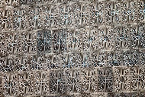 A metal pattern on the outside of a building Stock Photos
