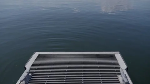 Metal Pier Platform Over Calm Water Surface 動画素材 313295644
