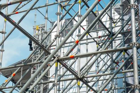 Metal pipe frame structure on blue sky background. Industrial construction fr 스톡 사진