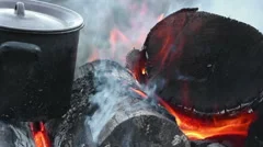 https://images.pond5.com/metal-pot-heating-burning-firewood-footage-057272648_iconm.jpeg