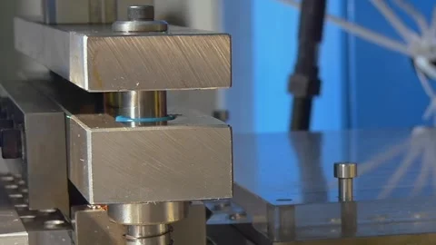 Metal Press Shaping Blue Plastic Parts in a Factory Stock Footage 340486455