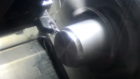 Metal processing and its water cooling on a lathe.with CNC. Stock Footage 149239204