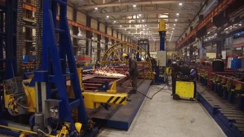 Metal processing in train car manufacturing workshop. Factory workers in Stock Footage 202048966