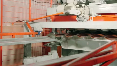 Metal processing. Trimming metal sheets. Metal tile production line at the Stock Footage 197321383
