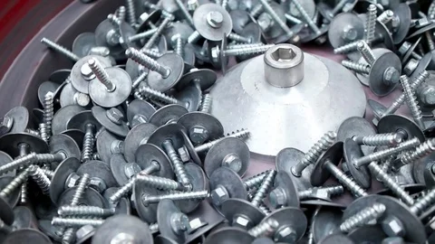 Metal products with screw thread moving on conveyor belt Stock Footage 83667726