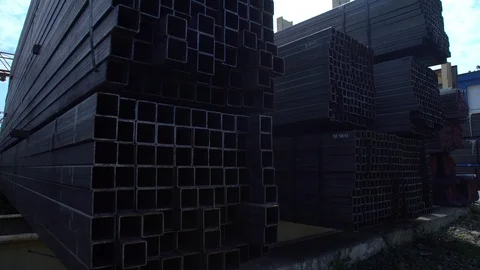 Metal profile pipe on a metal base lies in a heap Stock Footage 120352053